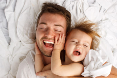 Father and daughter laughing